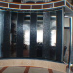 curved indoor water wall lobby entrance glass stone waterfall fountain