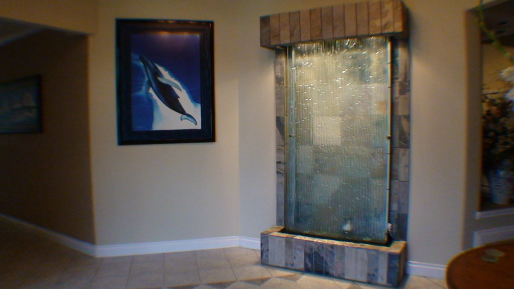 indoor stone backing with glass waterfall fountain