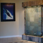 indoor stone backing with glass waterfall fountain