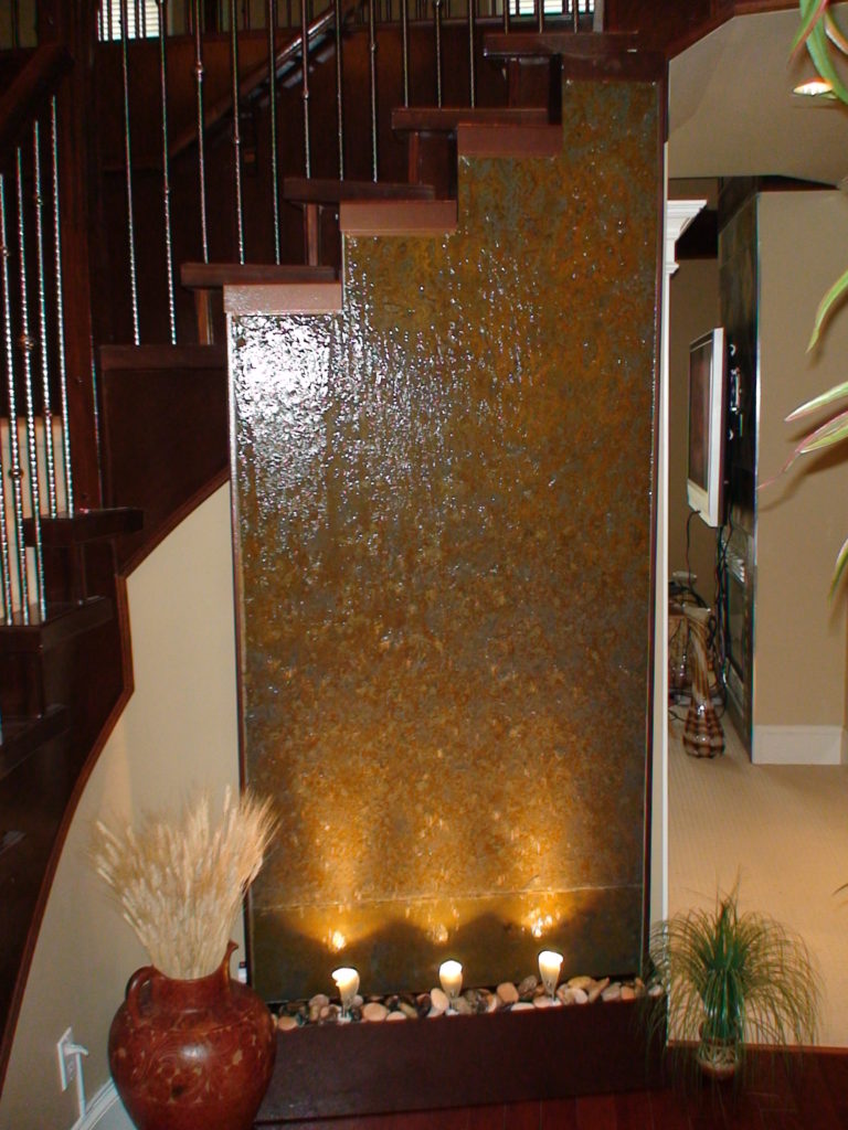 indoor stone stairwell water wall fountain